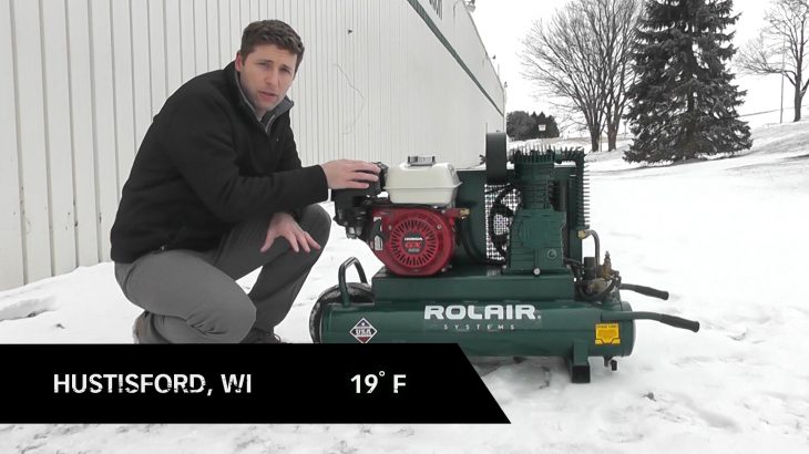 man with compressor outside during cold weather